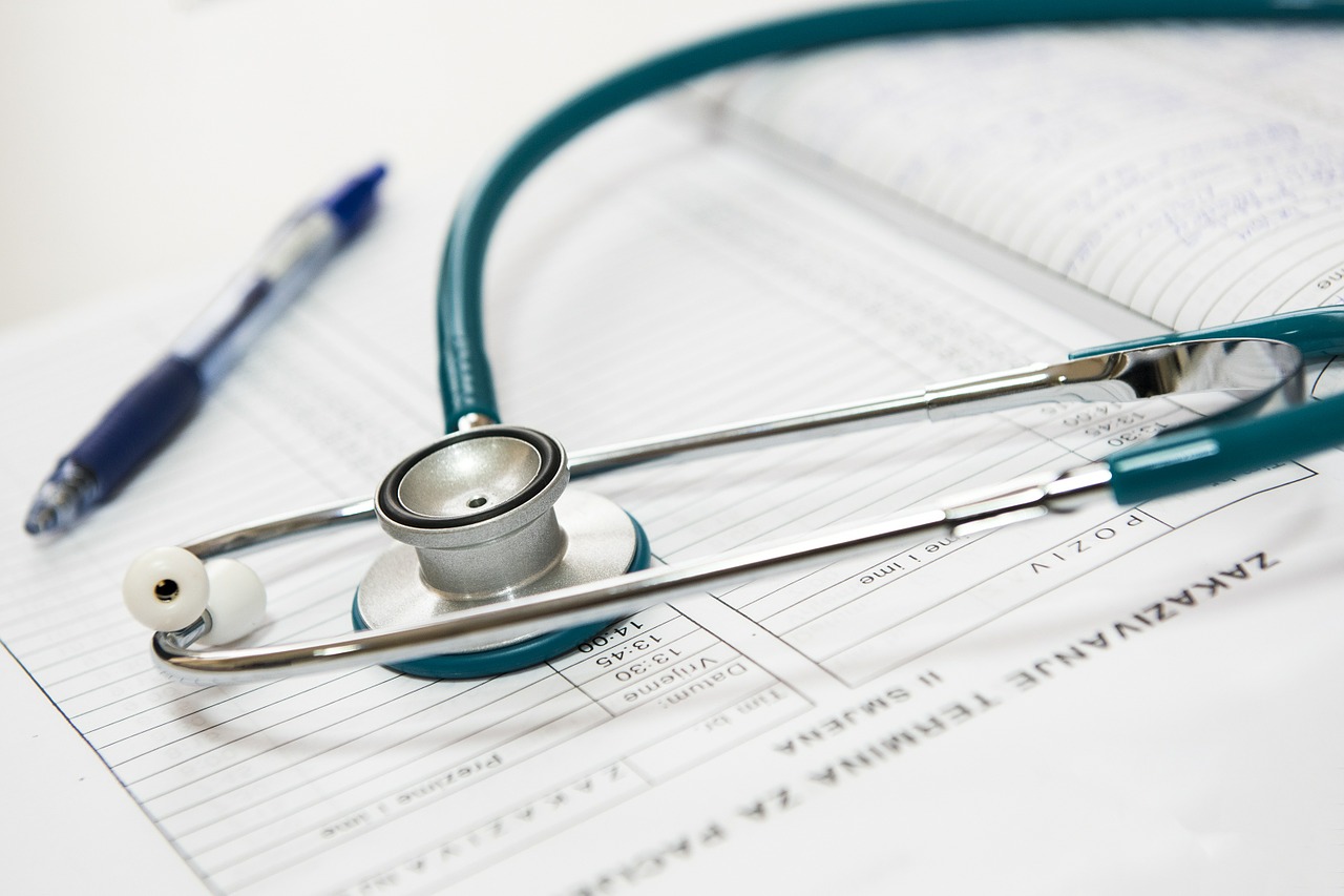 Stethoscope and a pen on a paper.